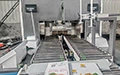 Machine de cerclage pour carton ondulé